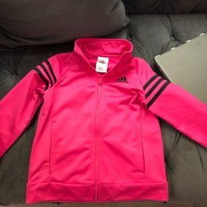 Girls pink with black stripes zip up top.